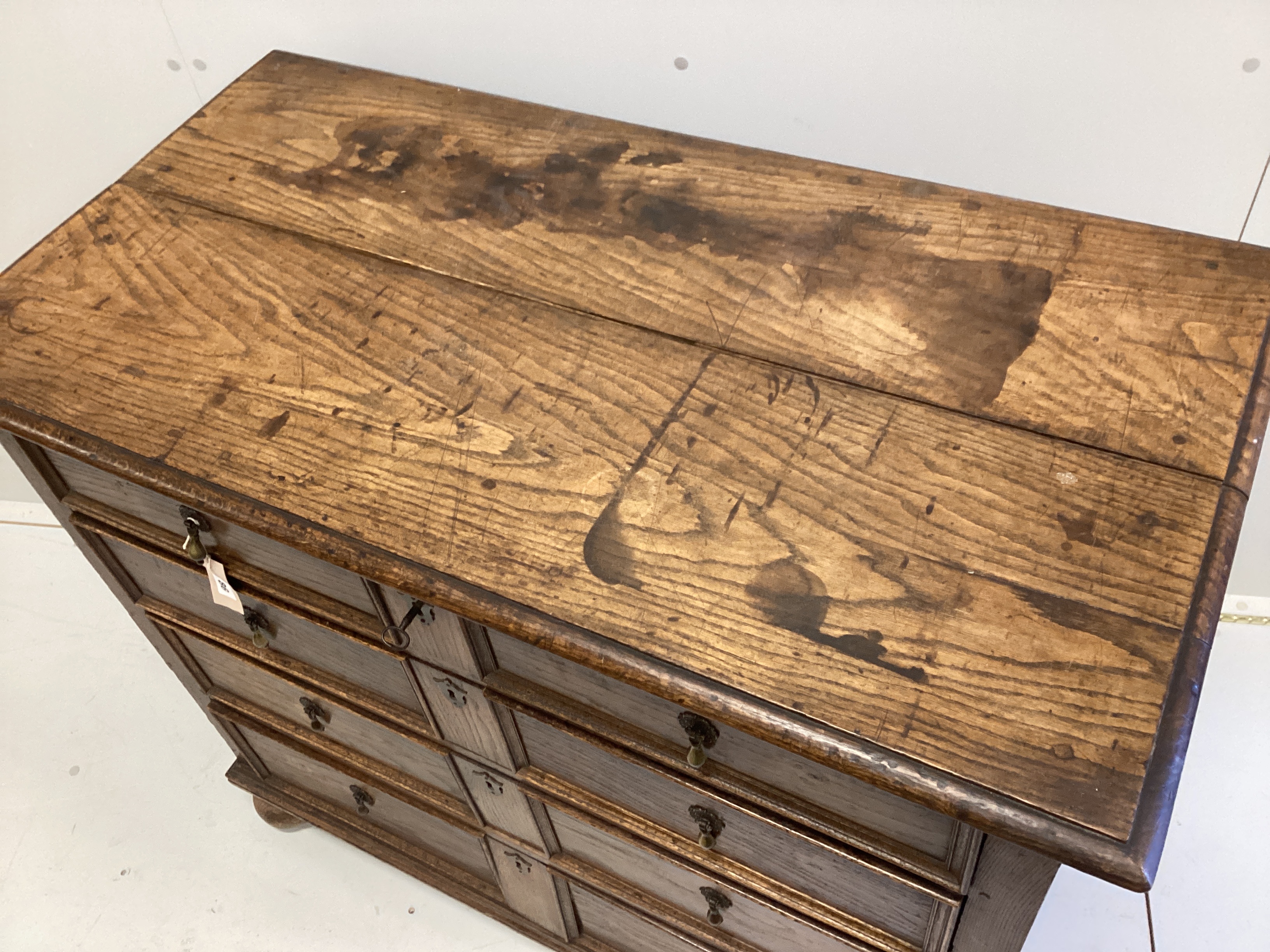 An 18th century oak four drawer chest, width 107cm, depth 56cm, height 90cm